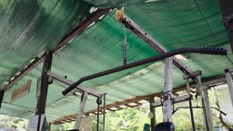 lat pulldown bar in an outdoor gym setting