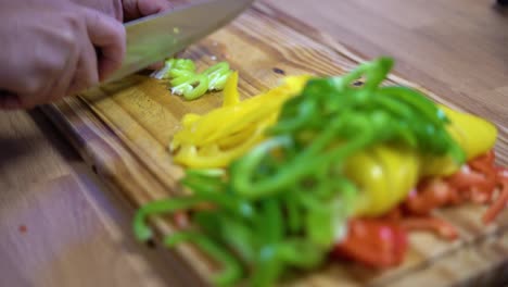 slicing bell peppers in julienne on wooden board kitchen healthy healthy diet