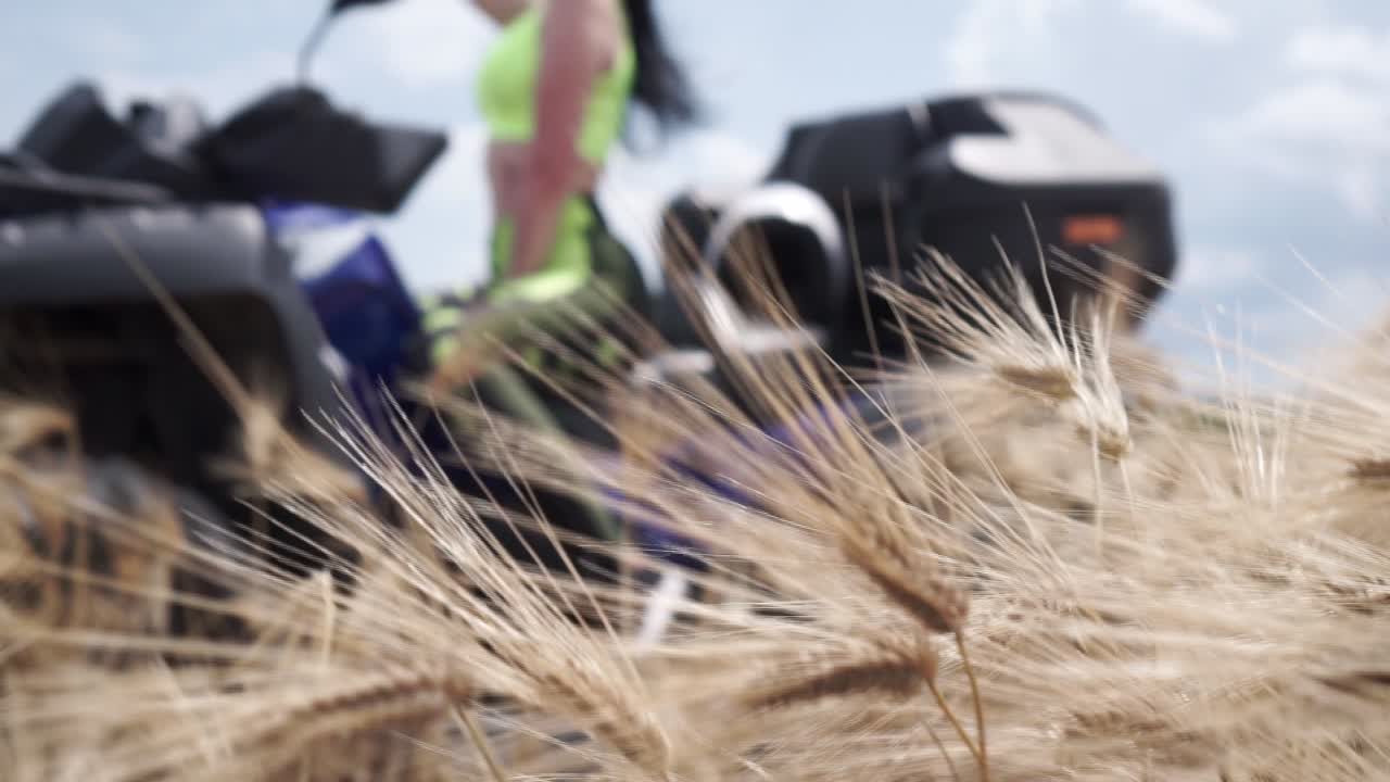 Woman on a Motorcycle in a Wheat Field