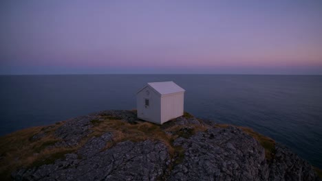 coastal cabin at sunset