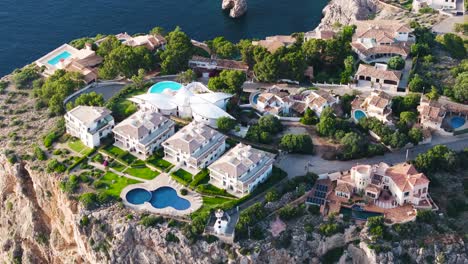 aerial view of luxurious villa property on mirador de la mola cliff, mallorca