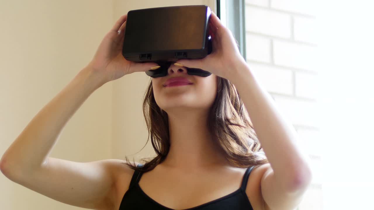 Smiling woman using virtual reality headset