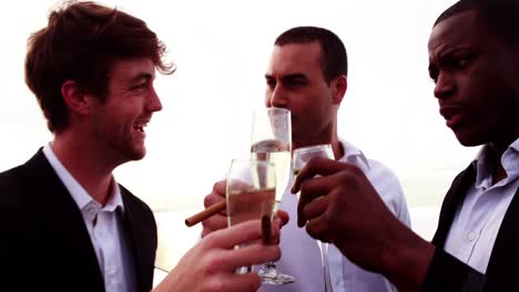 friends toasting flutes of champagne