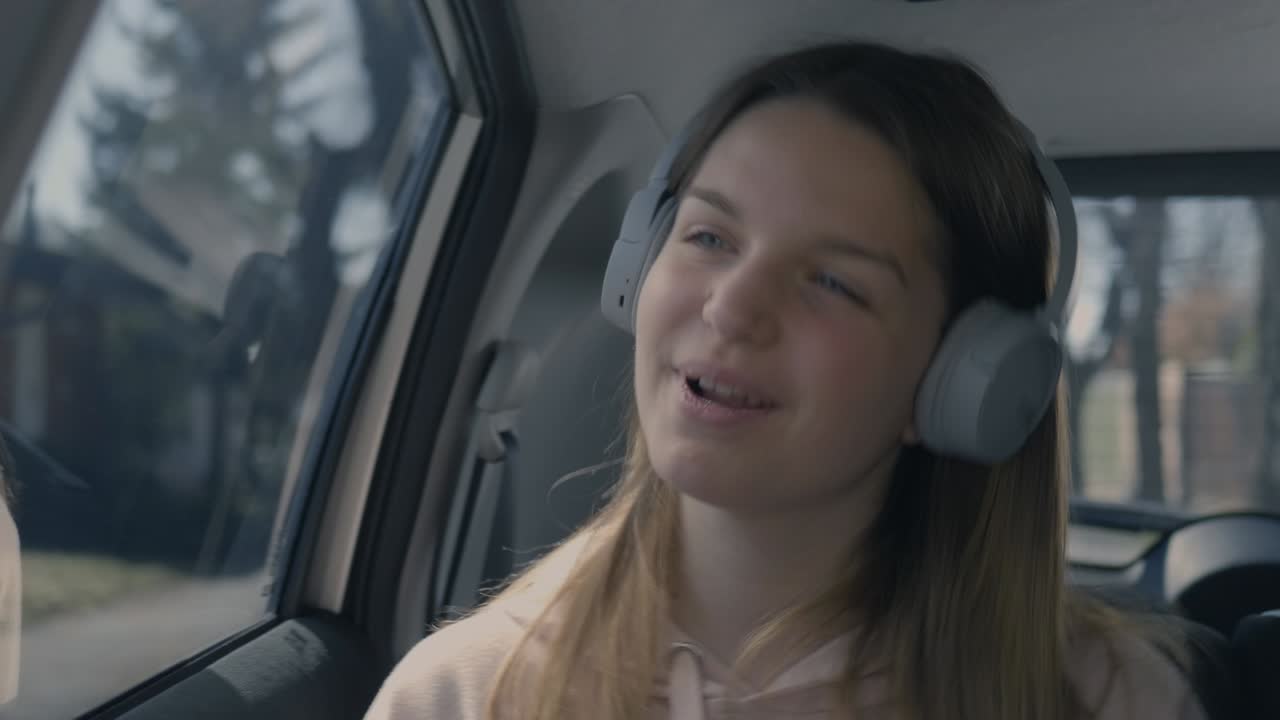 Girl Singing and Dancing in the Car