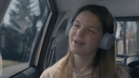 girl singing and dancing in the car