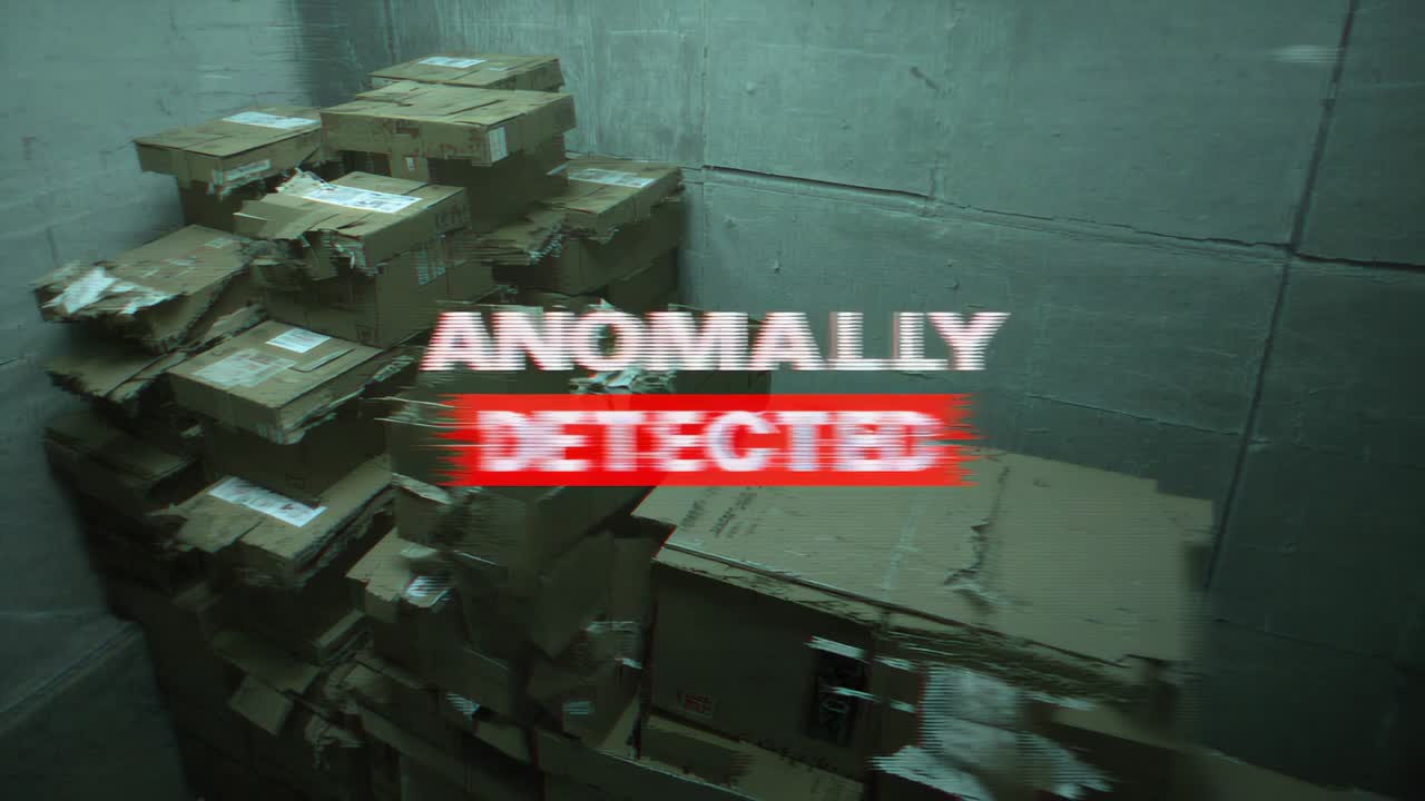 Camera detecting anomaly, marking tall cardboard stack in storage with red banner ANOMALLY DETECTED