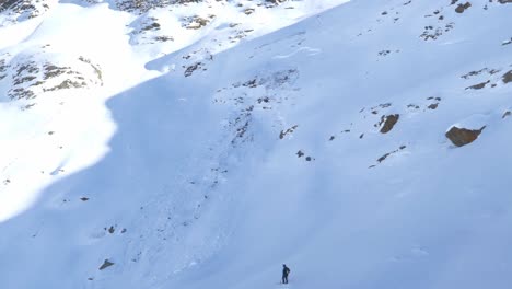 snowy mountain wall with a avalanche trail, in the alps of tyrol - tilt view