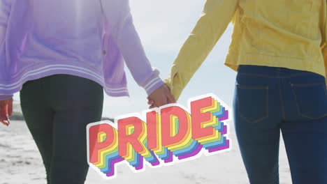 animation of pride over hands of lesbian couple walking on beach