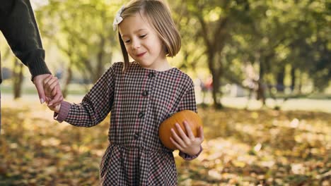 handheld video shows of mother and daughter during autumn walk