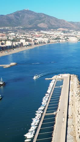 traditional mediterranean fishing boat returning to fuengirola spanish port