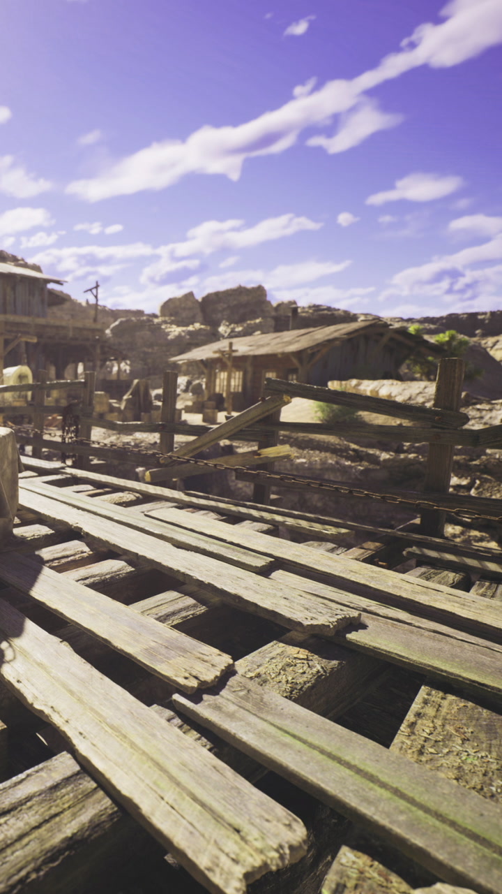 Rustic wooden bridge stretches across a serene landscape under a wide sky