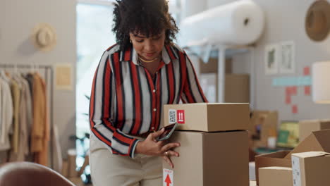 designer woman, phone and boxes in workshop