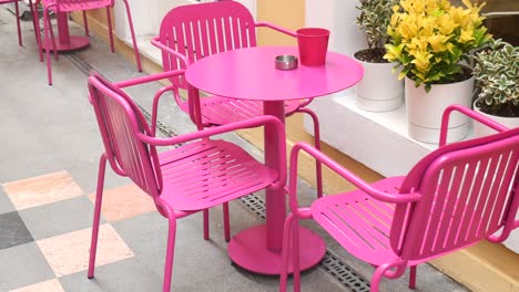 Outdoor cafe with pink furniture