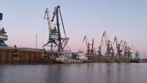 industrial port scene at sunset/sunrise