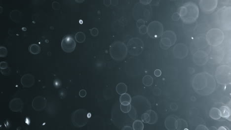 bokeh de partículas abstractas flotantes sobre fondo oscuro