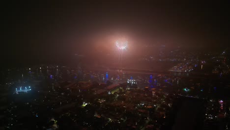aerial view of fireworks over city at night