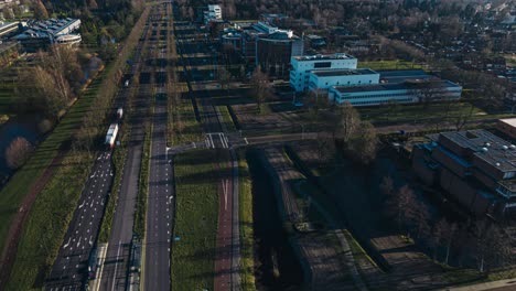 Aerial-hyperlapse-showing-buildings,-cars-and-city-landscape