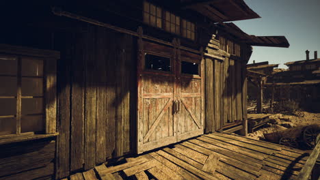 rustic wooden building in an abandoned town under clear blue sky