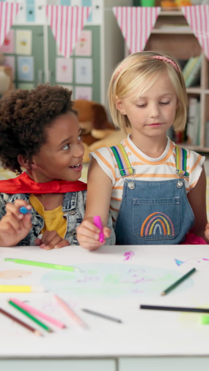 Two children drawing together