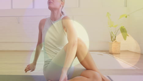 practicing yoga, woman stretching on mat with light flare animation