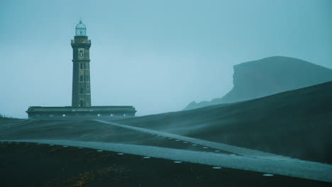 Stunning-medium-close-up-shot-of-the-Ponta-dos-Capelinhos-lighthouse-in-a-storm