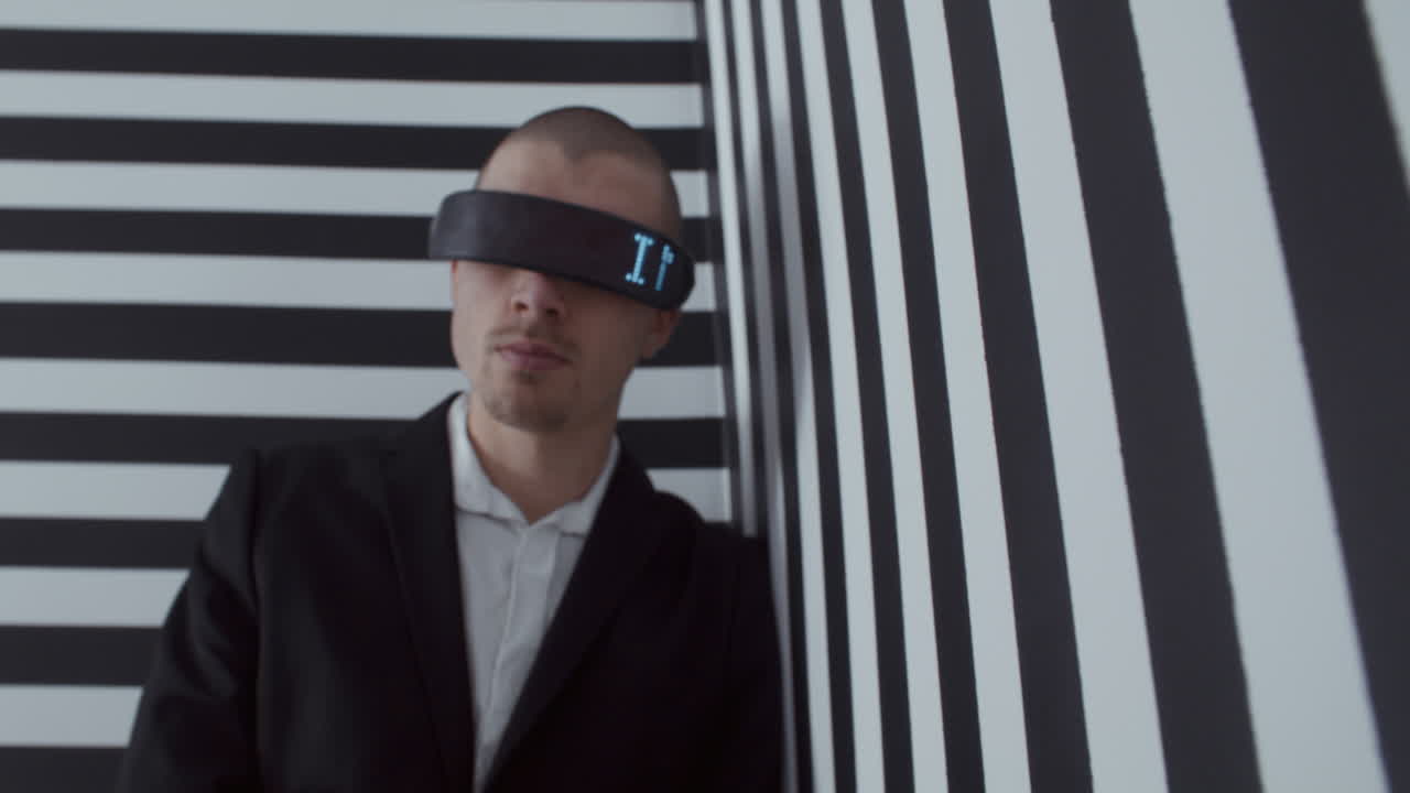 Man Wearing VR Headset in Striped Room