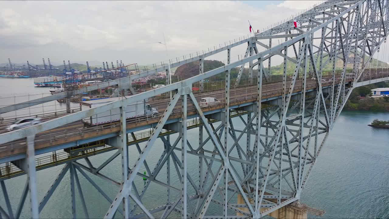 Aerial view of Panama canal first bridge heading towards the city