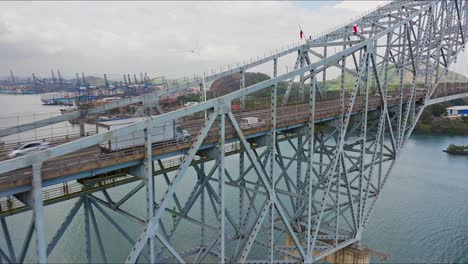 aerial view of panama canal first bridge heading towards the city