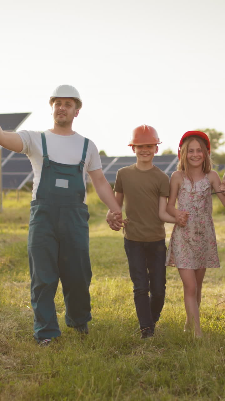 Family walking near solar panels
