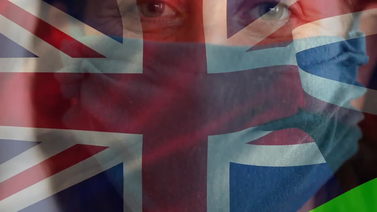 bandera británica ondeando contra una mujer con una máscara facial