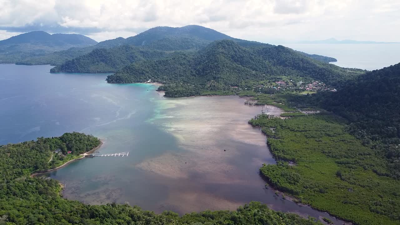 Aerial view of tropical island of Pulau Weh Sabang in Aceh, Sumatra, Indonesia with ocean, mangroves, forest and volcanic landscape