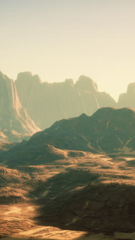 breathtaking view of desert mountains under bright sunset sky