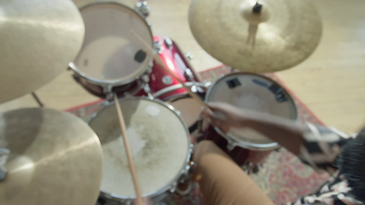African American Drummer Playing Drumkit