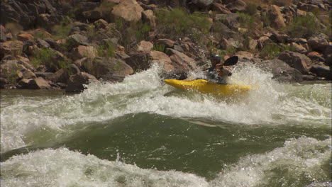 white water kayaker navigates the grand canyon 1