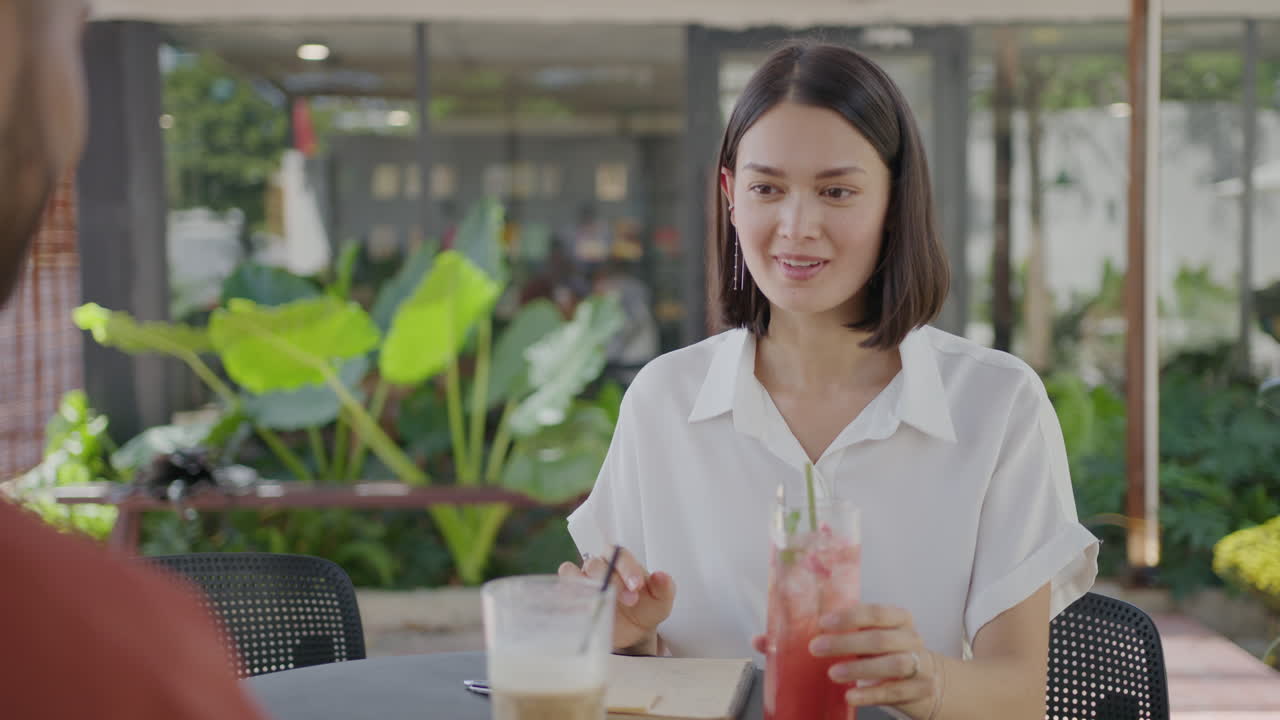 Woman Drinking Cocktail on Business Meeting in Outdoor Cafe