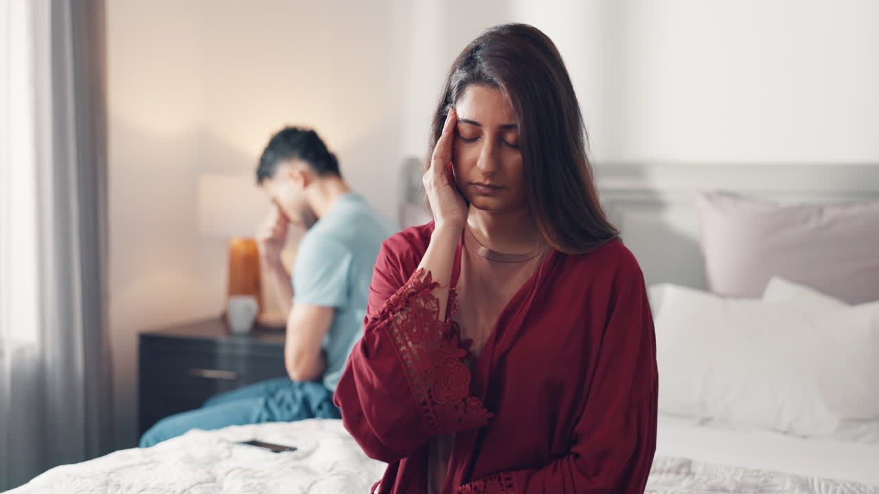 Upset Couple in Bedroom