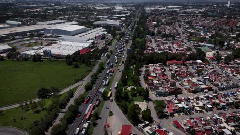 aerial orbital drone shot over the mexico–querétaro highway during a traffic jam in the suburbs of mexico city