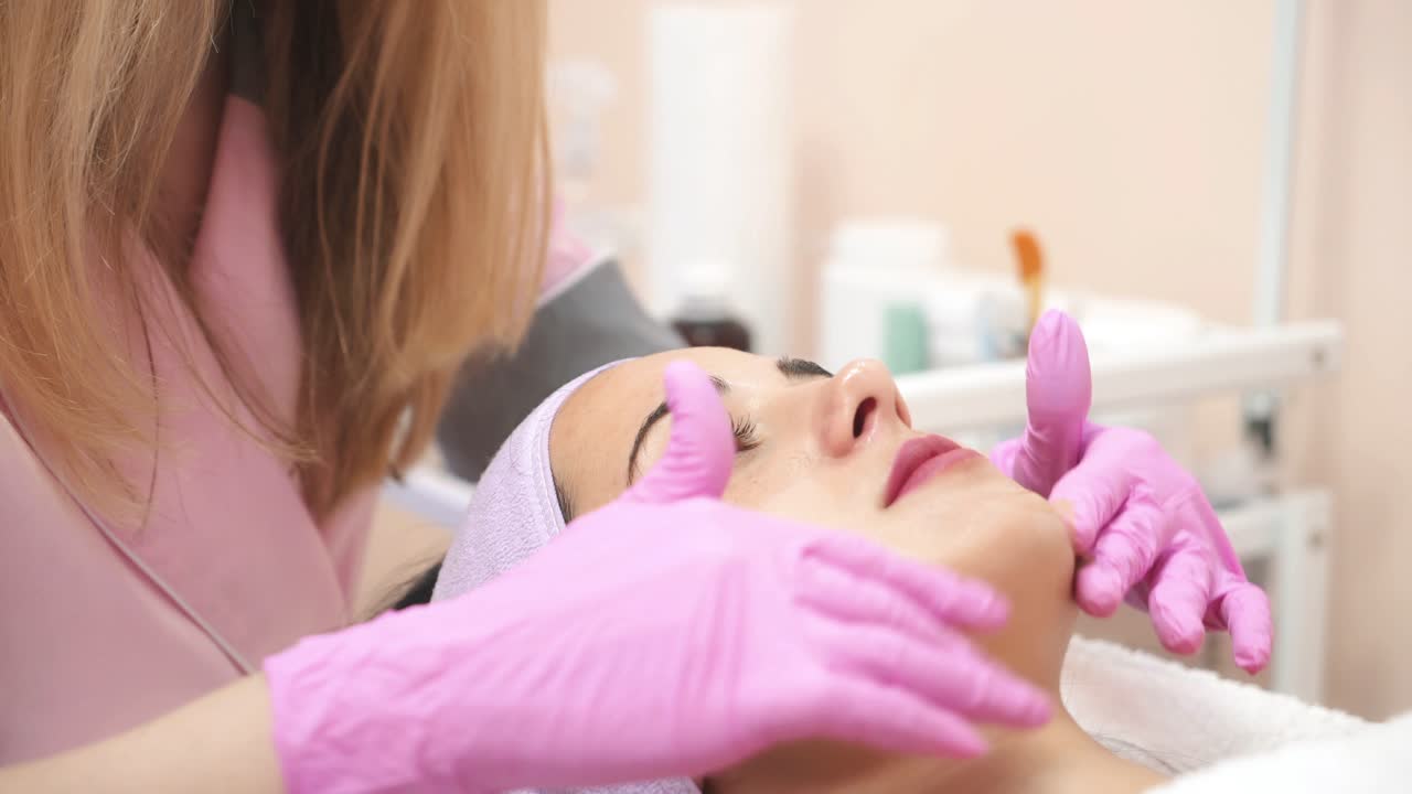Relaxing girl in spa salon. Young beautiful girl in mask for face relaxing in spa salon