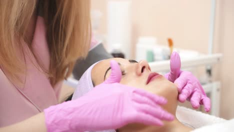 relaxing girl in spa salon. young beautiful girl in mask for face relaxing in spa salon