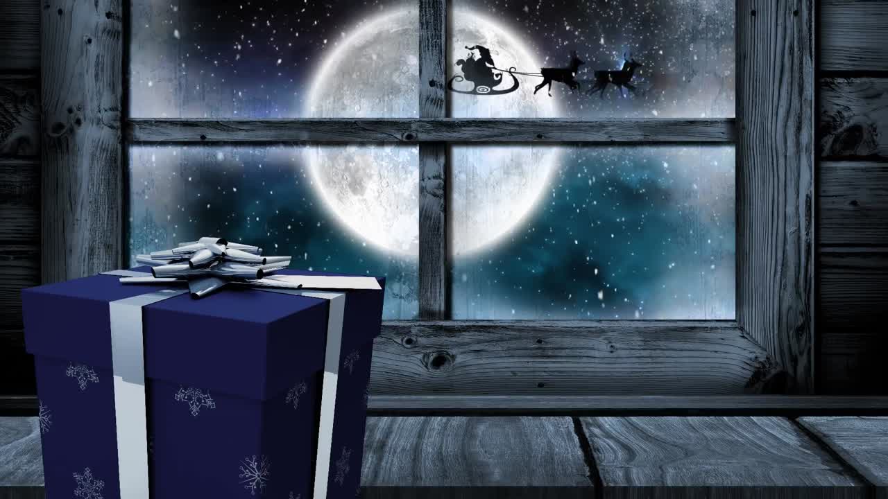 Animation of christmas gift and window, with falling snow, full moon and santa's sleigh outside