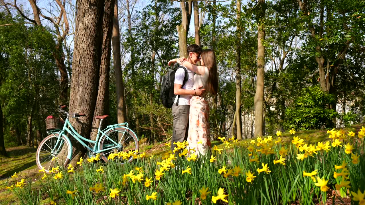 Couple in a Park with Daffodils and a Bicycle
