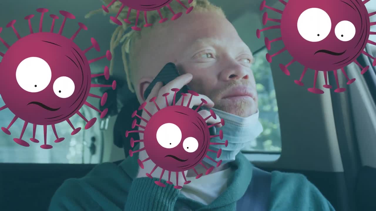 Animasjon av virusceller over afroamerikansk albinomann med smarttelefon