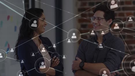 Network-of-connections-against-portrait-of-diverse-male-and-female-colleagues-talking-to-each-other-