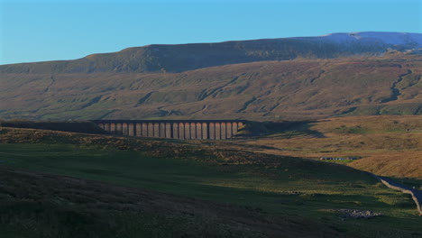 Rising-Establishing-Drone-View-of-Ribblehead-Viaduct-and-Snowy-Whernside