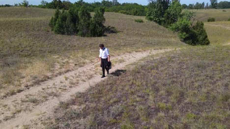 High-angle-view-of-poet-Sandor-Petofi-walking-dirt-road-in-Fulophaza,-Hungary