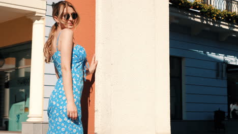 woman in a blue floral dress