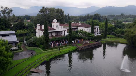 4k aerial view of the majestic volcano in antigua, guatemala, on a hazy day. the scene highlights the volcano’s grandeur against a soft, misty backdrop