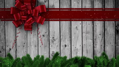 Animation-of-christmas-red-bow-over-wooden-background