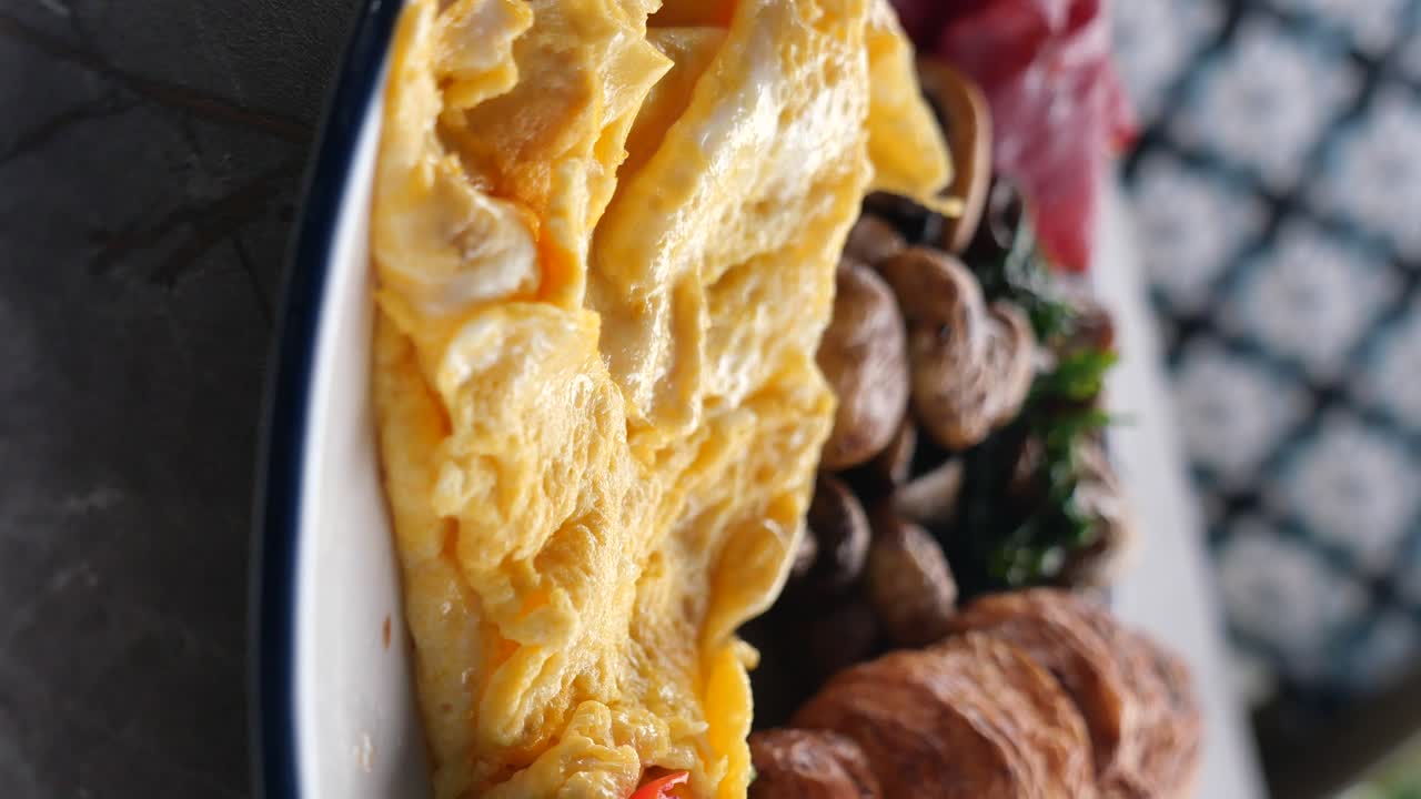 Breakfast with Scrambled Eggs, Mushrooms, and Croissant