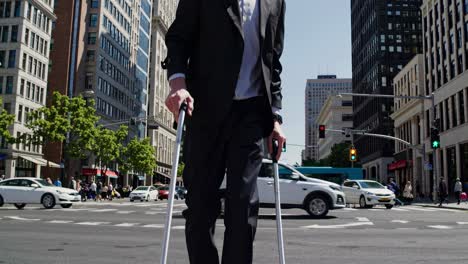 businessman in vr headset using canes while crossing a street in a busy city